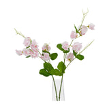 Hill Interiors Pale Pink Sweetpea Stem faux flowers with ruffled blush blooms, green leaves and trailing tendrils in a clear glass vase on a white background.