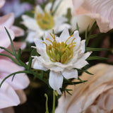 Close-up of Hill Interiors White Nigella Love In A Mist faux flower stem, showing white star-shaped petals, yellow-green stamens and feathery foliage.