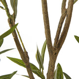 Close-up of the Hill Interiors Apulia artificial olive tree showing textured brown branches and slender silvery-green leaves against a white background.
