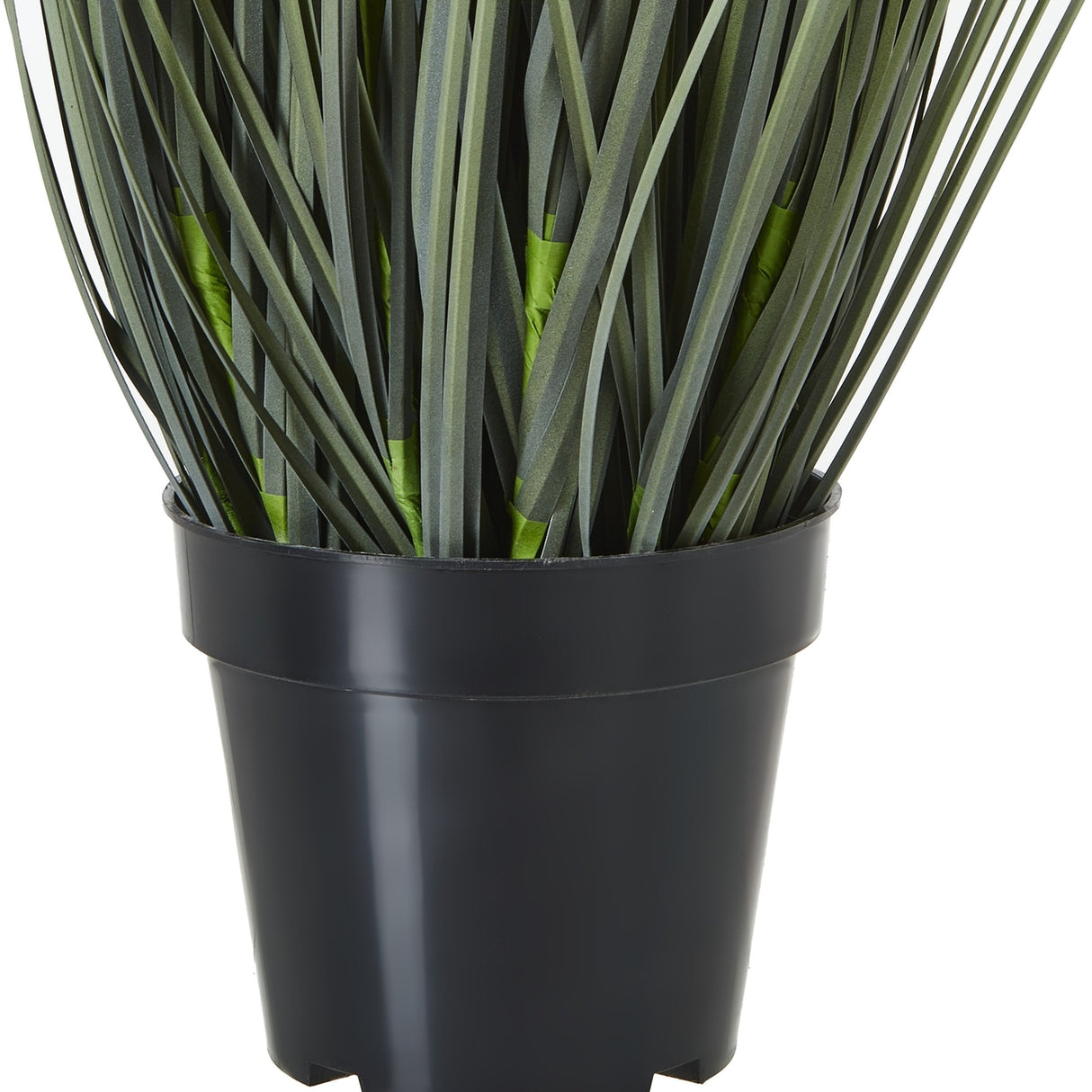 Close-up of the Hill Interiors Large White Meadow Plant In Pot, showing slim green faux grass stems gathered in a black plastic pot.