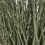 Close-up of the Hill Interiors Fountain Grass Plant In Pot, showing slender green plastic blades with tapered tips against a plain white background.