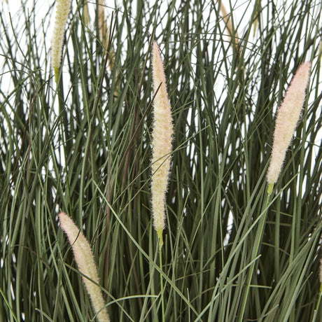 Close-up of Hill Interiors Large Fountain Grass faux plant showing slender green blades and soft cream-pink feathery plumes against a white background.