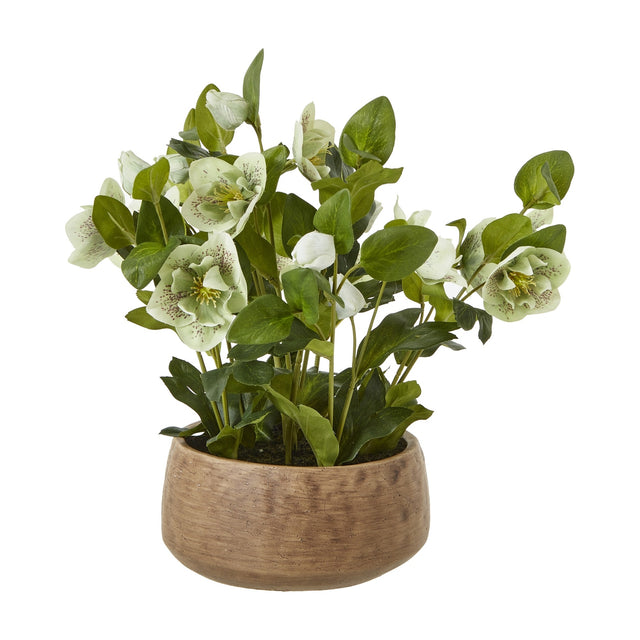 Hill Interiors green hellebore faux plant with cup-shaped blooms and lobed foliage in a taupe pot, shown on a plain white background.
