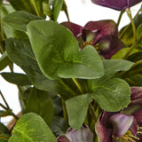 Close-up of the Hill Interiors Deep Plum Hellebore faux plant, showing toothed green palm-shaped leaves and deep purple five-petalled blooms.