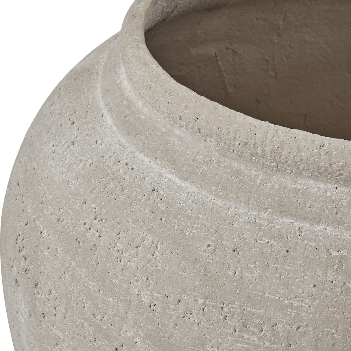 Close-up of the Hill Interiors Ordo Shaded Sand planter showing its textured beige stone-effect surface, rounded shoulder and wide open rim.