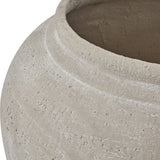 Close-up of the Hill Interiors Ordo Shaded Sand planter showing its textured beige stone-effect surface, rounded shoulder and wide open rim.