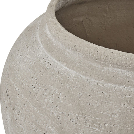 Close-up of the Hill Interiors Ordo Shaded Sand planter showing its textured beige stone-effect surface, rounded shoulder and wide open rim.