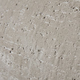 Close-up of the Hill Interiors Ordo Shaded Sand planter surface showing textured beige finish with pitted, stone-like detailing.