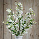 Hill Interiors Turks Cap Green Lily Spray arranged with multiple white lily blooms and green foliage in a pale vase against a wooden plank backdrop.