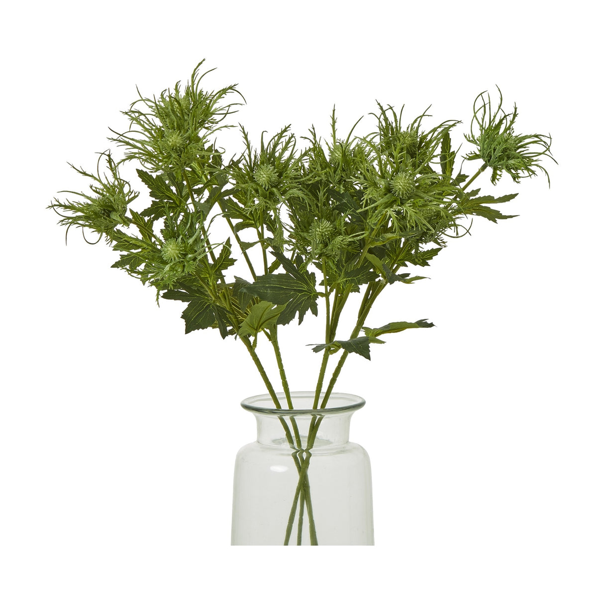 Hill Interiors Green Sea Holly Spray faux foliage stems with spiky thistle-like heads and textured leaves, arranged in a clear glass vase on a white background.