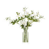 Hill Interiors Cream Pearl Clematis Spray arranged in a tall clear glass vase, showing multiple stems of cream blooms and green leaves.