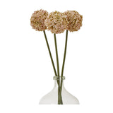 Three Hill Interiors Pink Allium Stem faux flowers with round pom-pom blooms in soft rose tones, arranged in a clear glass bottle vase on a white background.