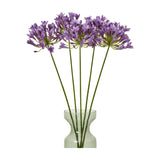 Hill Interiors Lilac Agapanthus Spray with five tall stems of clustered purple blooms arranged in a green glass vase against a white background.