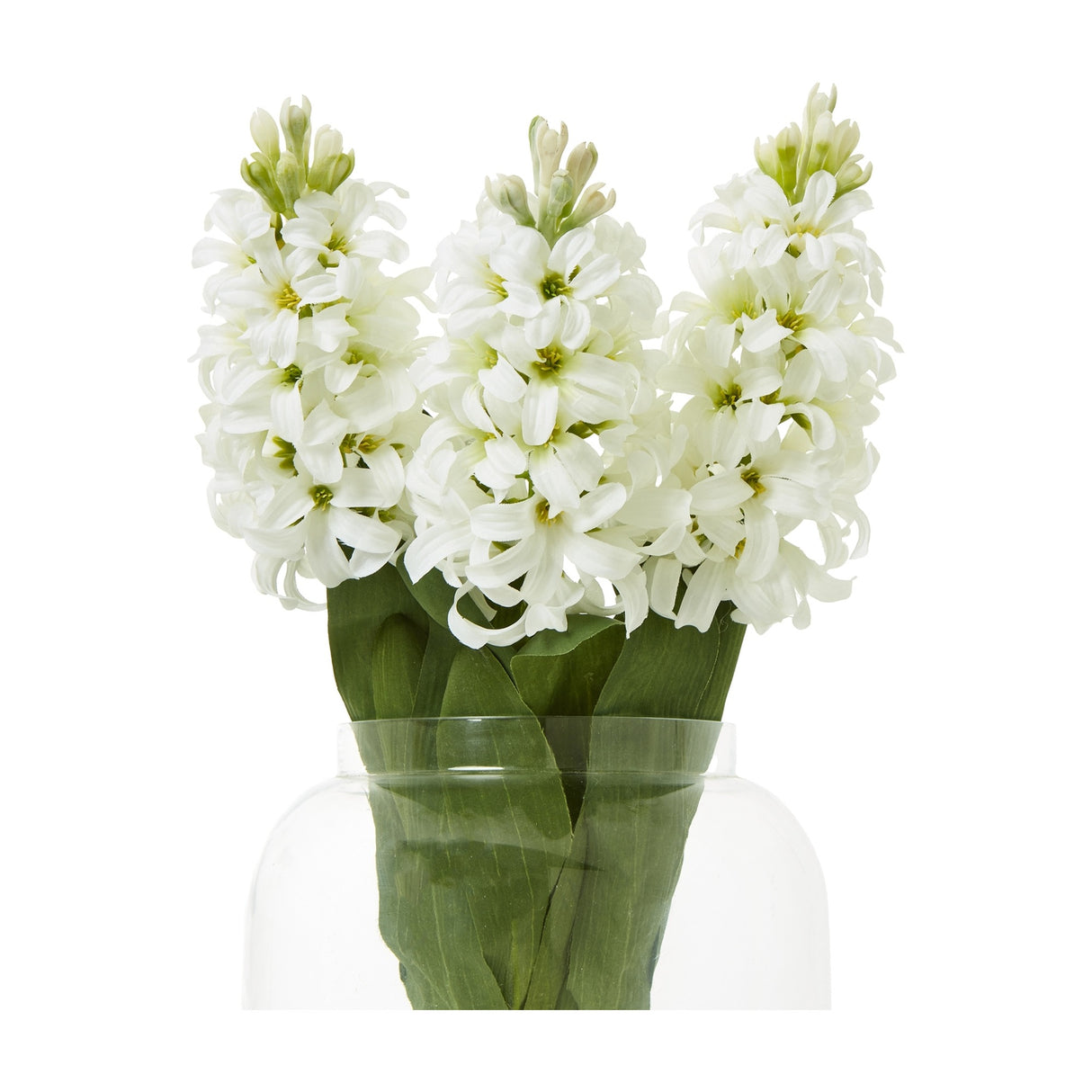 Hill Interiors White Hyacinth Stem shown as three faux stems with clustered star-shaped florets and green leaves in a clear glass vase.