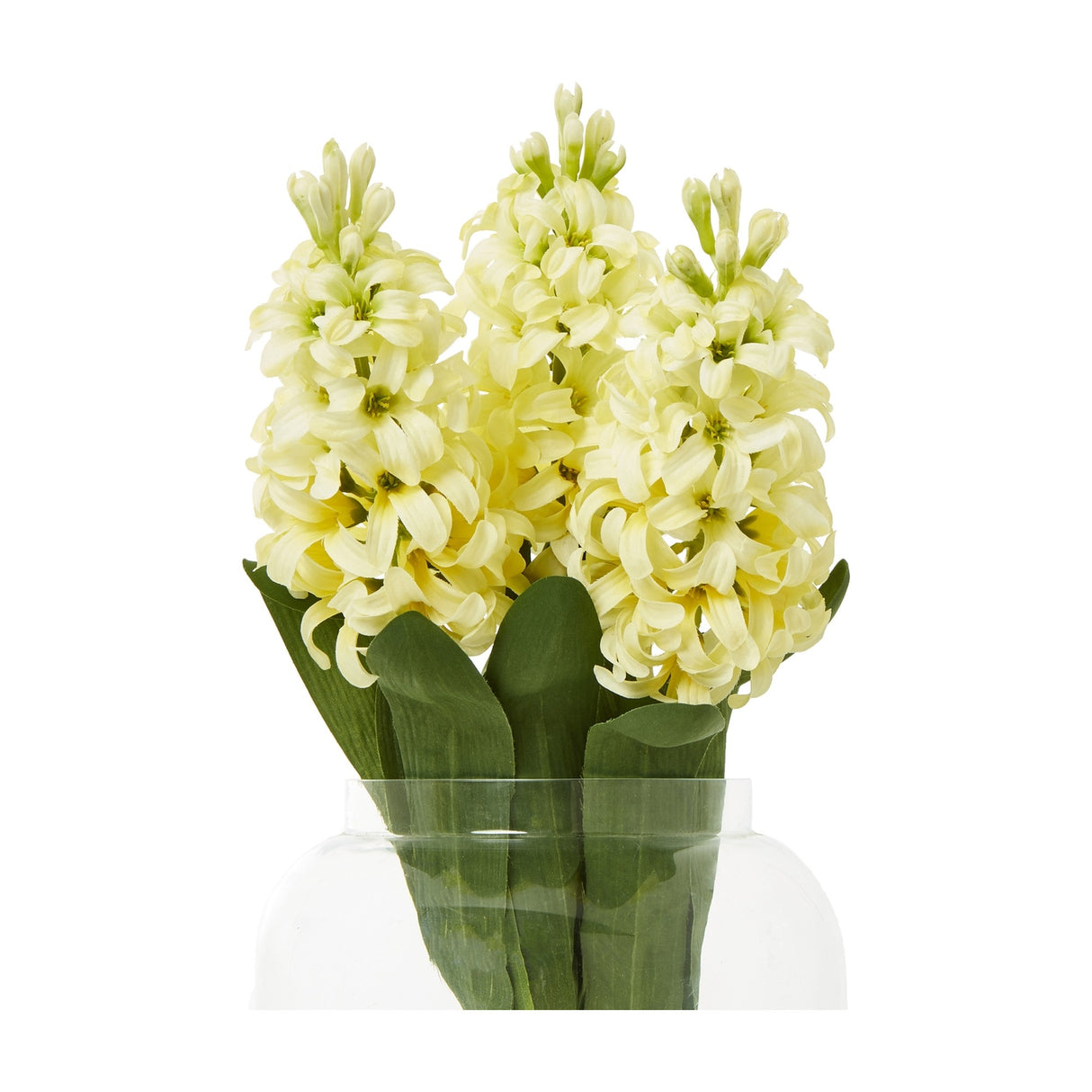 Hill Interiors Yellow Hyacinth Stems, three faux flower spikes with pale buttery florets and green leaves in a clear glass vase on a white background.