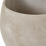 Close-up of a Hill Interiors Kyros Shaded Sand planter showing the textured beige finish and pale tonal variation across its rounded rim.