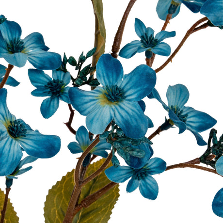 Close-up of the Hill Interiors Blue Vernicia Fordii Spray showing muted blue five-petal blossoms with veined petals, green buds and brown branching stems.