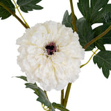 Close-up of Hill Interiors White African Marigold Large Spray showing a dense dome of layered white petals with a dark centre and green foliage.