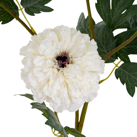 Close-up of Hill Interiors White African Marigold Large Spray showing a dense dome of layered white petals with a dark centre and green foliage.