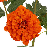 Close-up of the Hill Interiors Orange African Marigold Large Spray showing a densely ruffled orange pom-pom bloom with slim green foliage behind.