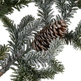 Close-up of Hill Interiors Woodland Pine Tall Stem showing frosted green needles and two brown pinecones nestled among the foliage on a white background.