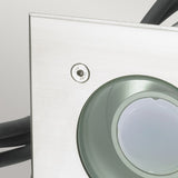 Close-up of the Rena LED Square Recessed Spotlight - Silver, featuring a metallic construction with a circular lens set on its square base. The visible screws and cables indicate a sturdy design suitable for outdoor lighting. The smooth and reflective surface implies an IP68 waterproof rating, ensuring durability.