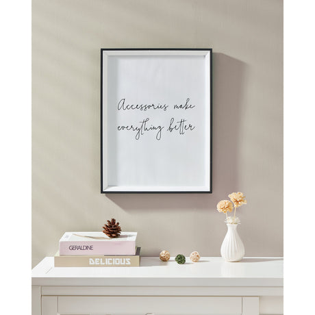 Renabie Photo Frame in black and white with slim black outer edge and white bevelled inset, shown hanging on a neutral wall above a white console table.