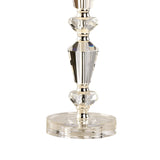 A close-up of the Renee 1 Light Crystal Table Lamp in a silver finish, showcasing clear faceted crystal and silver metal accents on a round crystal base—ideal for decorative interior lighting (shade not included).