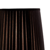 Close-up of the Renee 1 Light Crystal Table Lamp in a silver finish, shown with a black pleated shade (not included), against a white background. Light filters through the textured pleats, highlighting this decorative lighting piece.