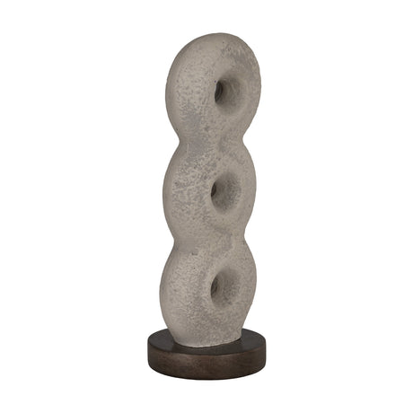 Rifu Sculpture, a textured grey decorative piece of three pierced rings stacked in a gentle twist on a round dark base, shown against a plain white background.