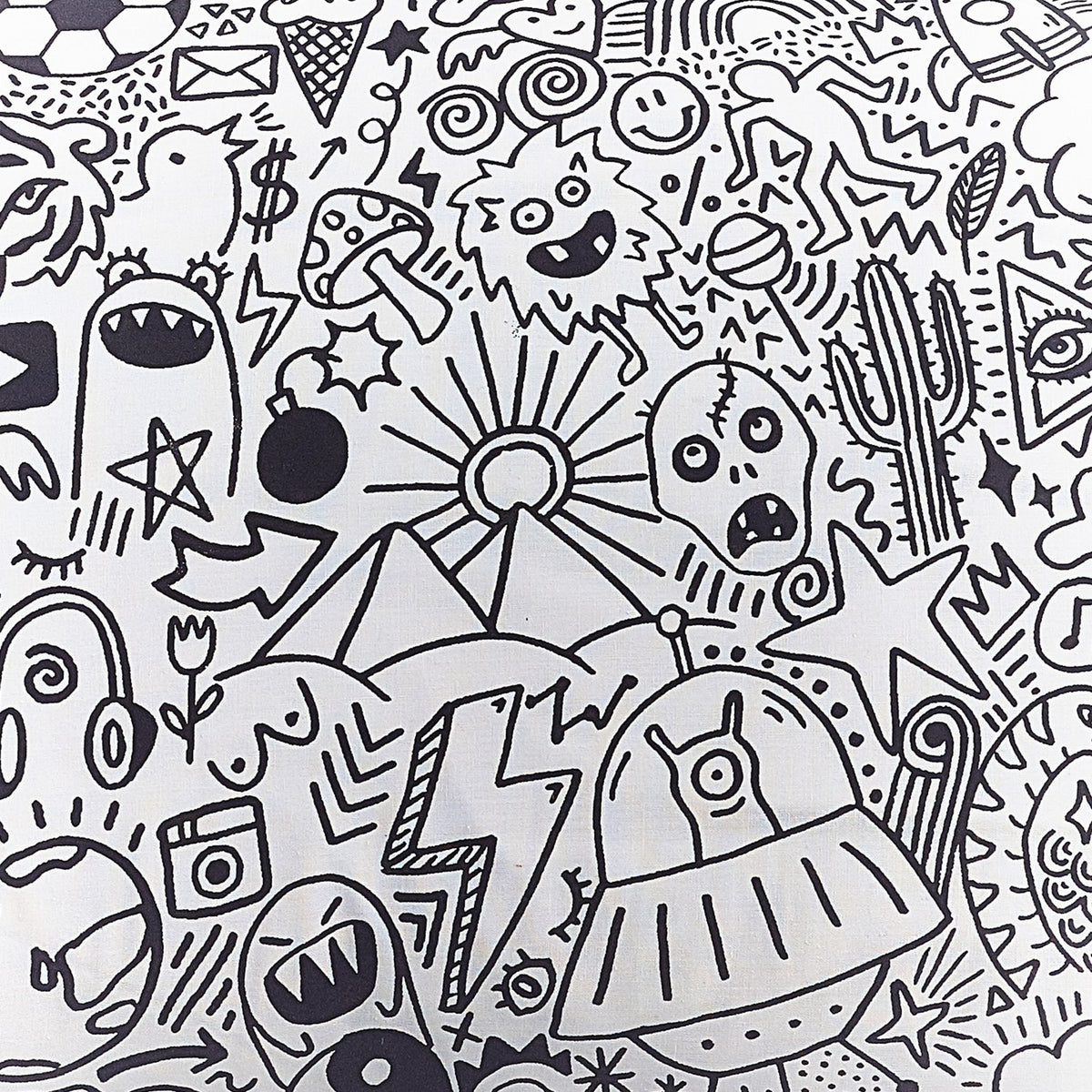 Doodles Polycotton Duvet Cover in white, printed edge to edge with black line-art doodles including aliens, skulls, monsters, cacti and lightning bolts.