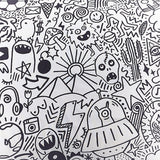 Doodles Polycotton Duvet Cover in white, printed edge to edge with black line-art doodles including aliens, skulls, monsters, cacti and lightning bolts.