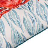 Close-up of the Abersoch Abstract polyester cushion in Marine, showing a coral-red crab print amid blue and teal leaf-like strokes with teal piped edge trim.