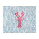 Abersoch Abstract Polyester Placemat in Marine, rectangular woven fabric mat with a pink lobster motif on a blue and white flowing coastal pattern, shown on a white background.