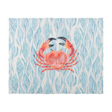 Abersoch Abstract Polyester Placemat in Marine, rectangular with a coral crab motif on a wavy blue and white coastal-inspired background, shown on a plain white surface.