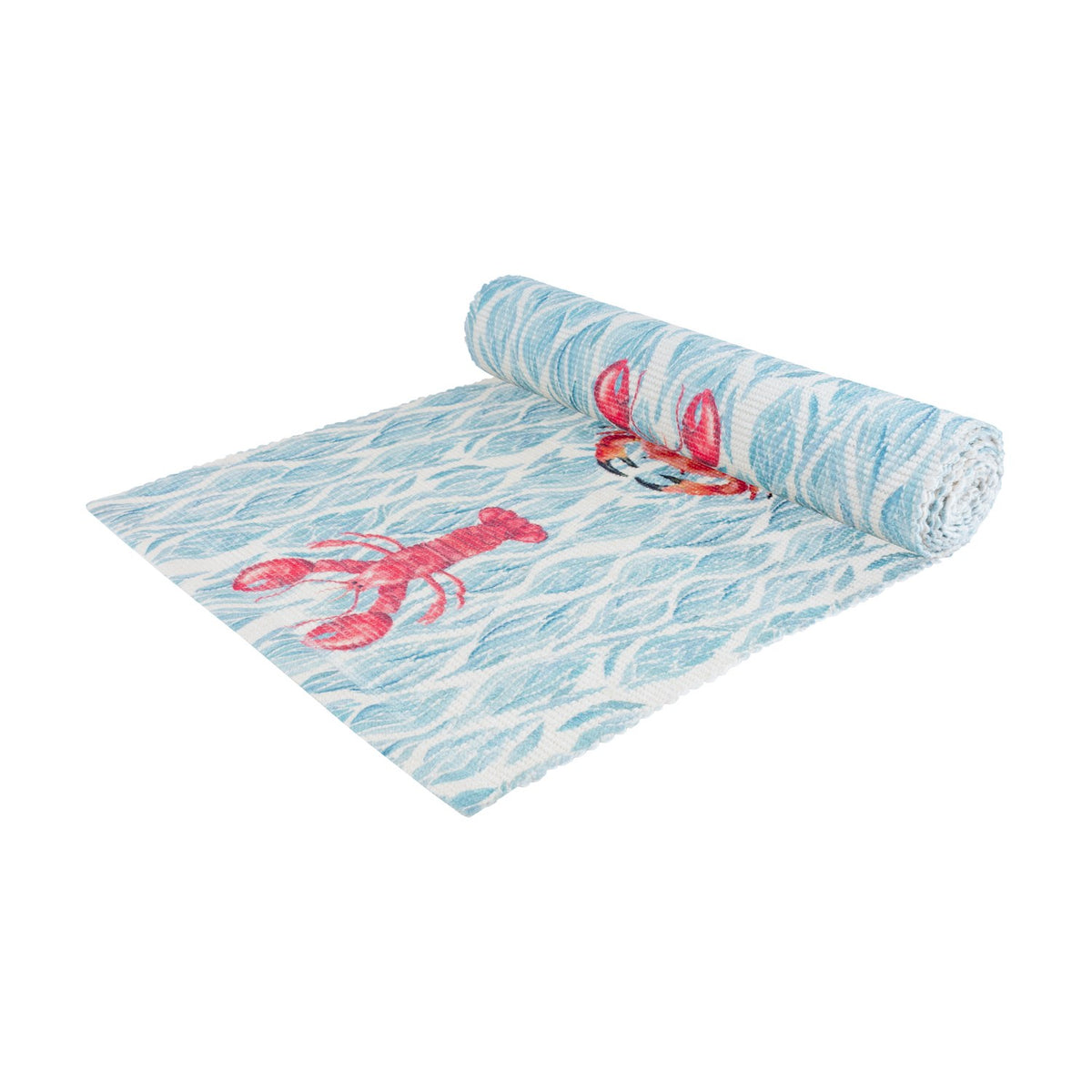 Abersoch Abstract Polyester Table Runner in Marine, partially rolled to reveal a woven blue and white wave pattern with pink lobster and crab motifs, on a plain white background.