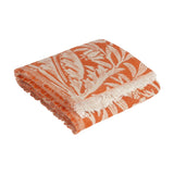Folded Acorn Tonal Jacquard Cotton Blend Throw in brick orange with a cream botanical leaf and acorn pattern and fringed edge, shown on a plain white background.