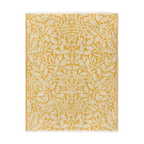 Acorn Tonal Jacquard Cotton Blend Throw in gold and cream, woven with an oak leaf and acorn pattern, finished with fringed edges on a plain white background.