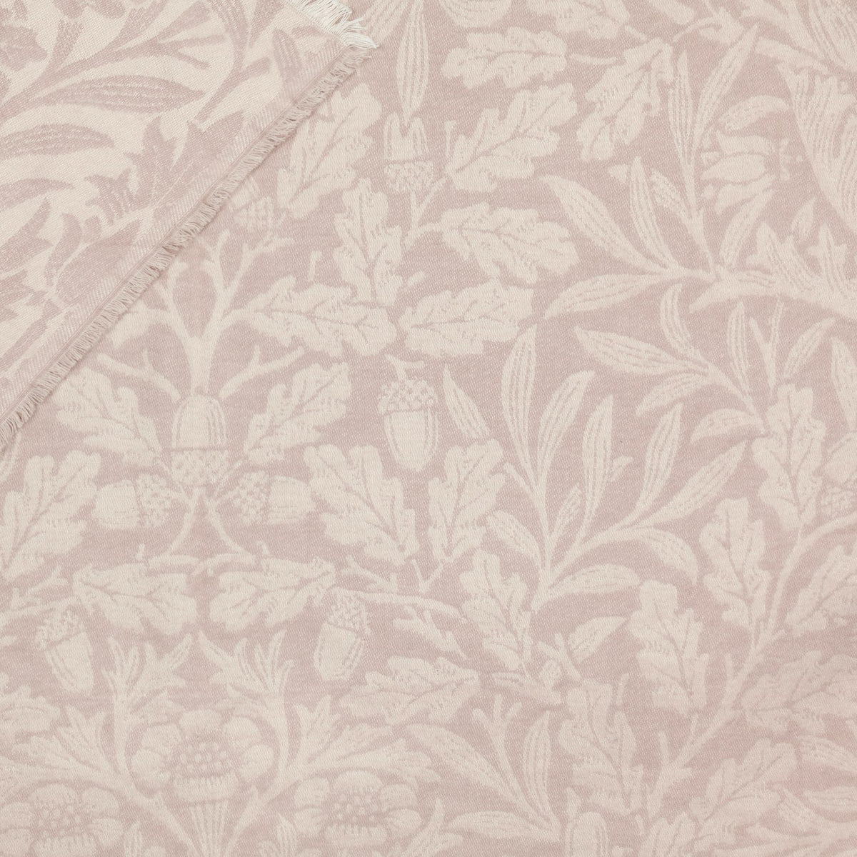 Acorn Tonal Jacquard Linen Throw in natural beige, woven with an oak leaf and acorn pattern in soft tonal shades, edge shown with fringed trim.