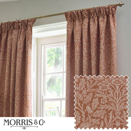 Acorn Tonal Jacquard Polyester Pencil Pleat Curtains in brick, showing a woven acorn branch pattern in pale cream, hung by a window with a fabric swatch inset.