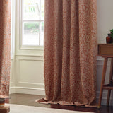Acorn Tonal Jacquard pencil pleat curtains in brick, showing a tonal acorn branch pattern in pale cream on rust fabric, styled floor-length beside a bay window.