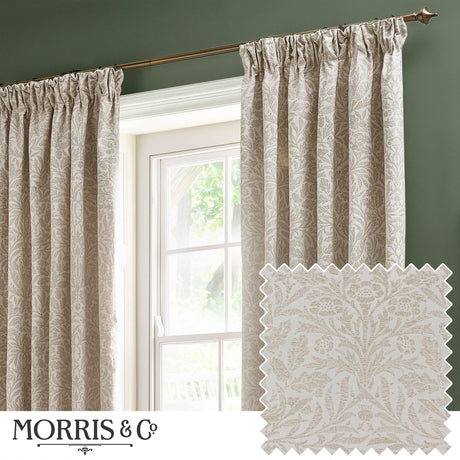 Acorn Tonal Jacquard pencil pleat curtains in cream Willow fabric with woven acorn and oak foliage pattern, shown pencil-pleated on a rod by a window, with fabric swatch inset.