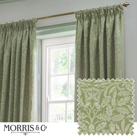 Sage green pencil pleat curtains with tonal Acorn jacquard foliage pattern, shown hanging beside a window, with a fabric swatch sample inset below.