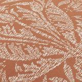 Close-up of the Acorn Tonal Jacquard Polyester Cushion in Brick, showing a woven cream oak leaf and acorn pattern on a textured brick-orange ground.