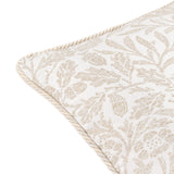 Close-up of the Acorn Tonal Jacquard Polyester Cushion in ivory, showing woven acorn branch pattern and twisted cord edge trim on a white background.