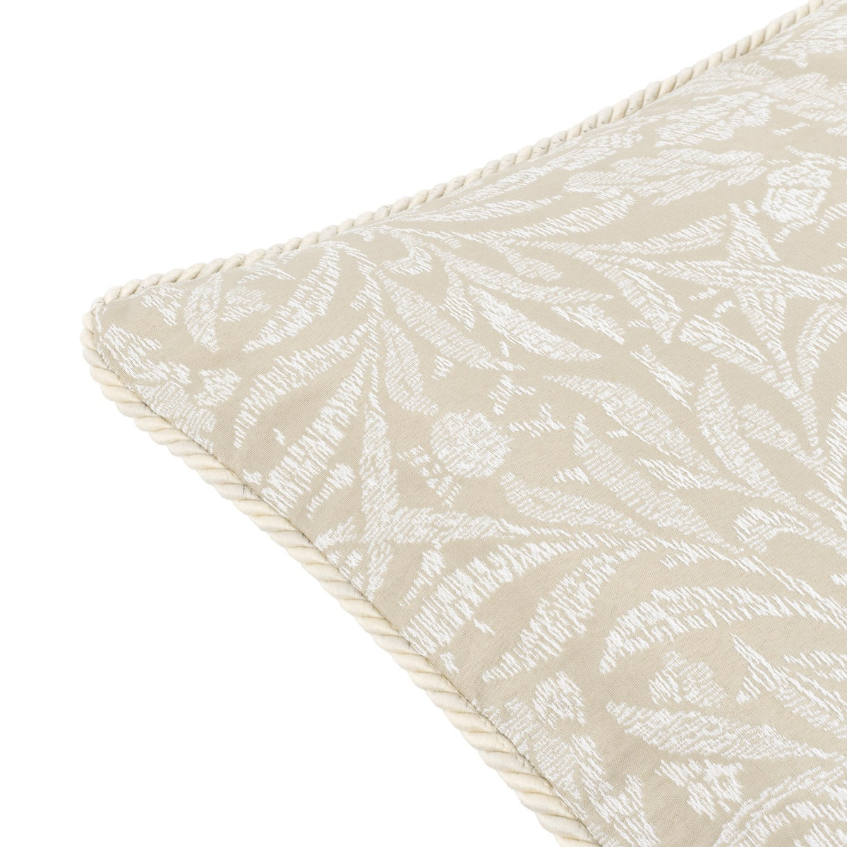 Close-up of the Acorn Tonal Jacquard Linen Cushion corner, showing a white leaf and acorn pattern on a linen-toned ground with cream twisted cord piping, on a white background.