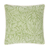 Square sage green cushion with a tonal jacquard acorn branch pattern in paler leaf tones, finished with cream cord piping, shown on a plain white background.