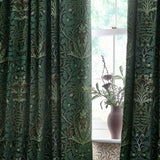 Pencil pleat curtains in the Acorn chenille jacquard design, shown framing a window in green and forest tones with woven oak leaf and acorn motifs.