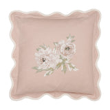 Square Adele Floral Cotton Cushion in Rose with scalloped cream-edged border and embroidered floral spray of two blooms with leaves on a pink cotton ground.