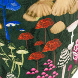 Amanita Abstract Velvet Door Stop in green, close-up of the printed fabric showing red, gold, blue and pink mushroom designs on a forest-green ground.